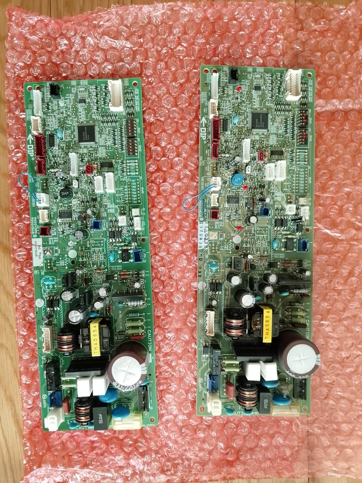 Two aircon control boards side by side, the old one and its replacement